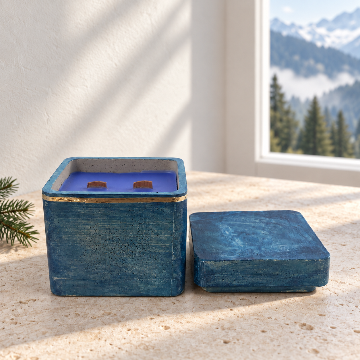 • An unlit hand-poured blue concrete candle jar open to display the smooth purple soy wax blend and unburned dual wood wicks with a matching concrete lid resting alongside.
