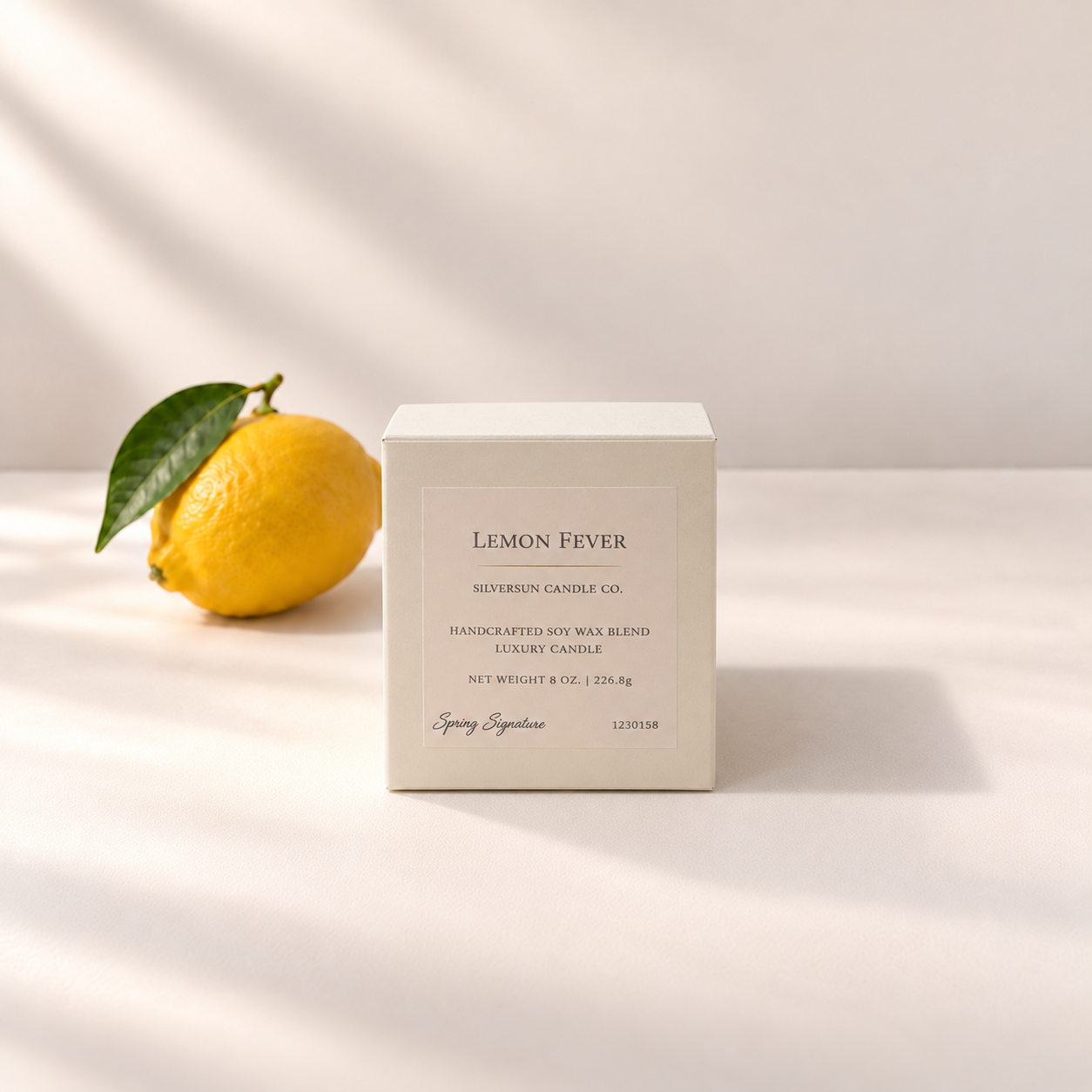 The elegant cream packaging box for Silversun Candle Company's Lemon Fever handcrafted soy wax luxury candle