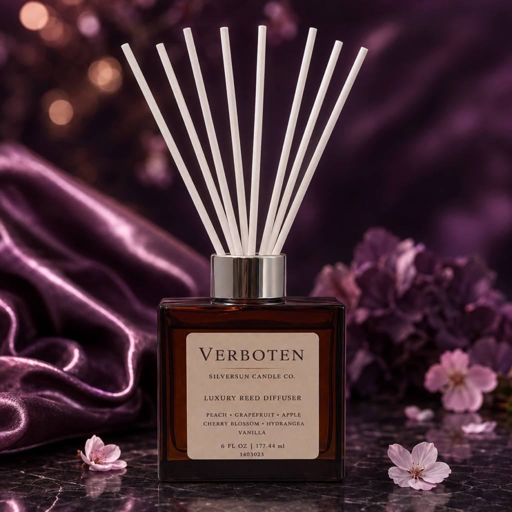 Verboten luxury reed diffuser with white fiber reeds and purple satin and flowers.